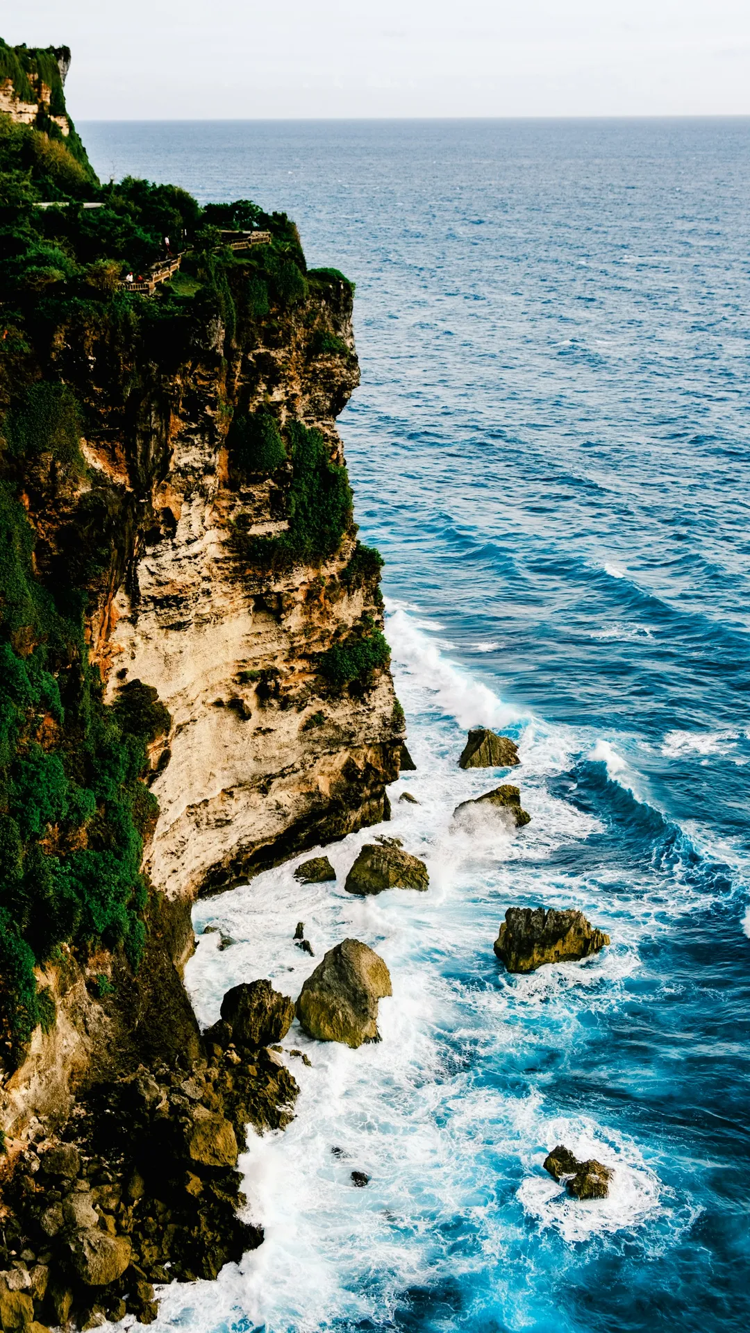 Coastal cliffs and blue ocean at Uluwatu, South Bali